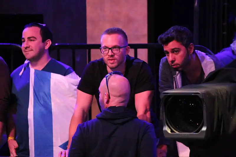 Two poker finalists walk out on stage before heads-up play